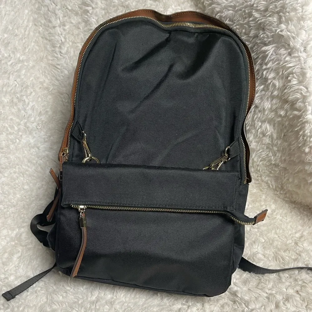 Tommy Bahama Black  Laptop Case Backpack With Brown trims and straps .